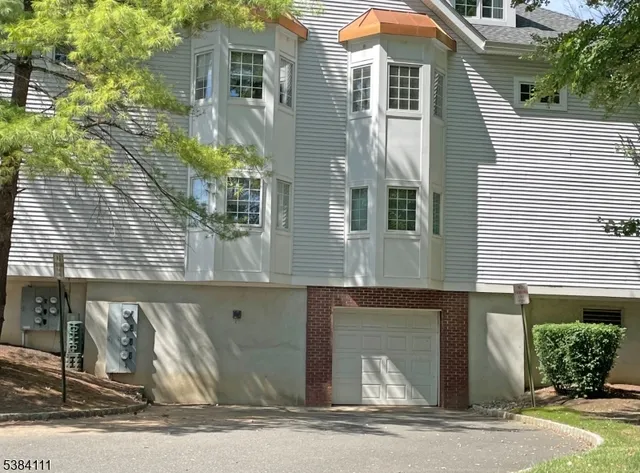a kitchen with a refrigerator and a sink