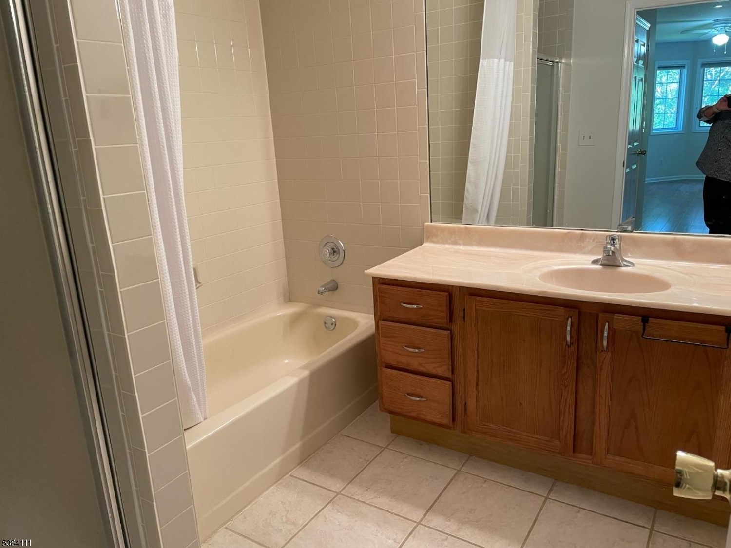 12 Leva Drive, Unit 12 Morristown, NJ 07960 - Photo 22 of 30 a bathroom with a granite countertop sink and a mirror