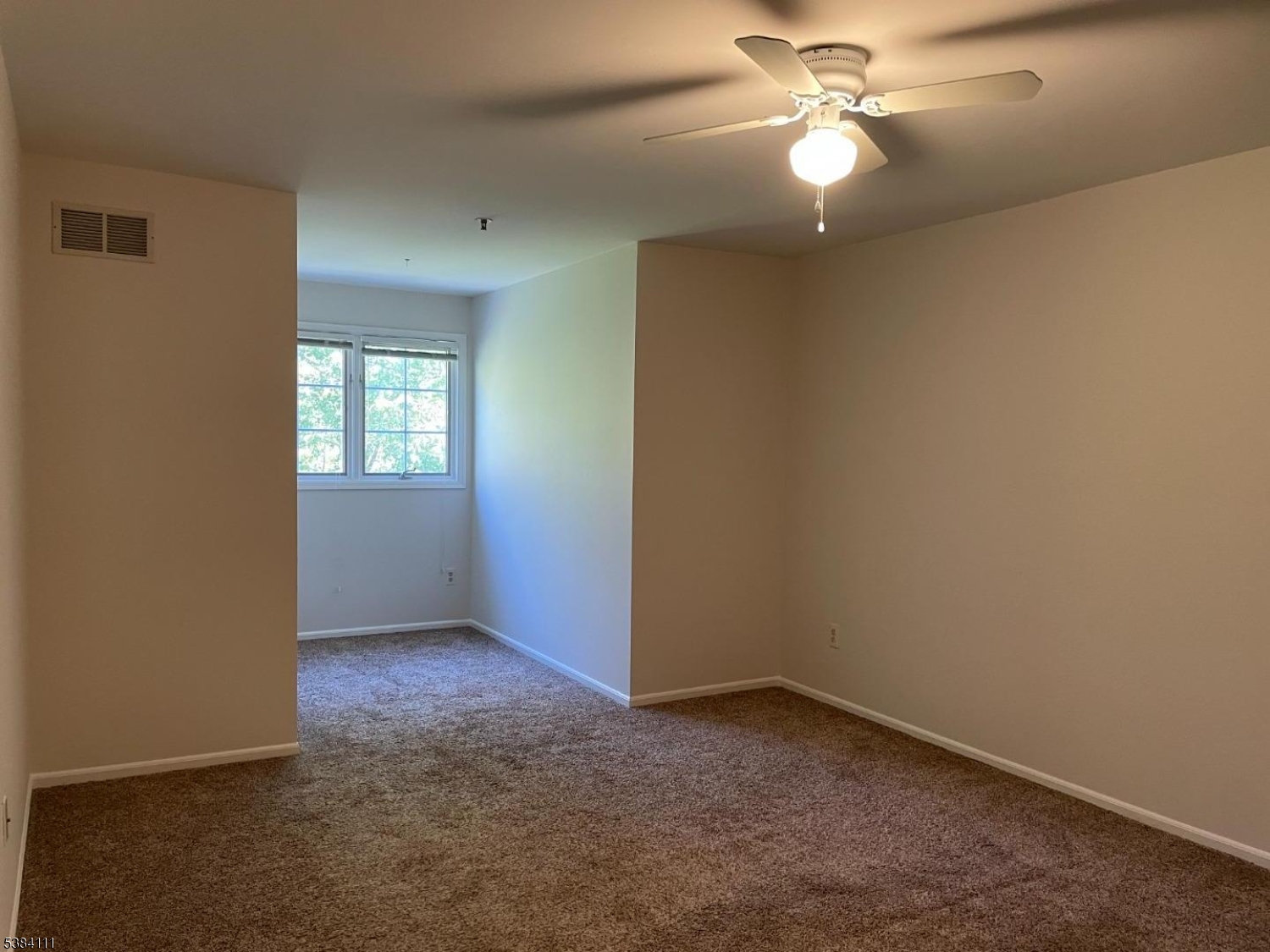 12 Leva Drive, Unit 12 Morristown, NJ 07960 - Photo 24 of 30 an empty room with windows and fan