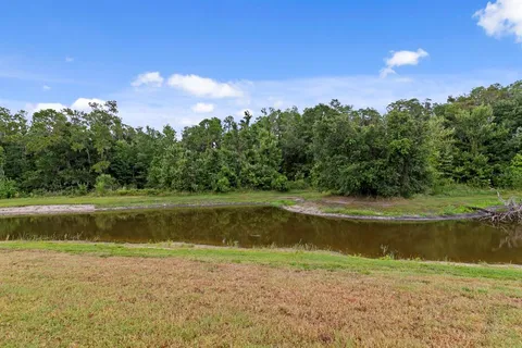 a view of a lake with a yard