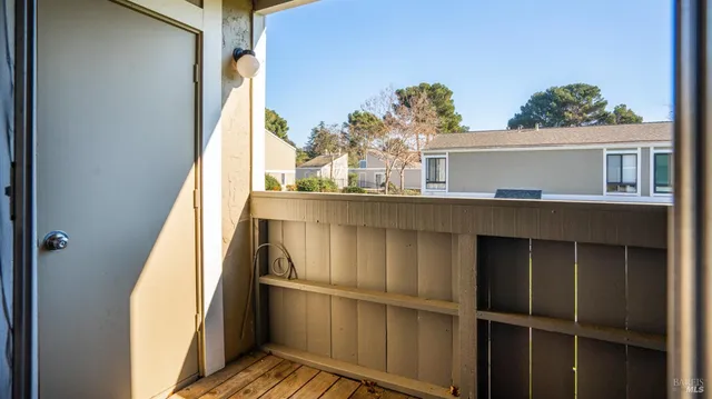 a view of balcony with furniture