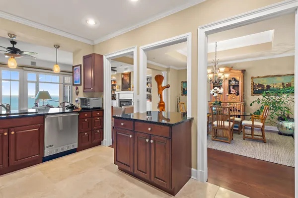 a kitchen with sink refrigerator and window