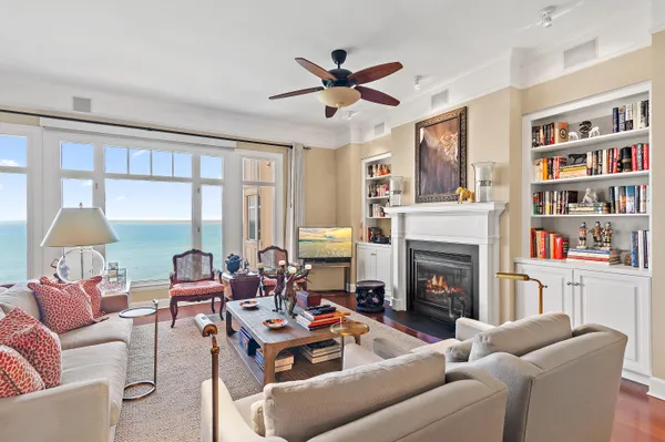 a living room with furniture and a fireplace