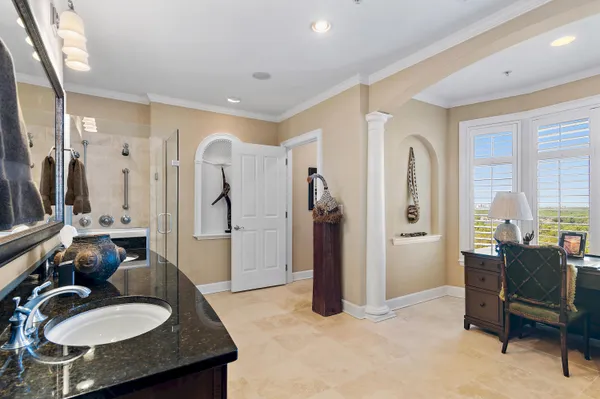 a spacious bathroom with a double vanity sink and a mirror