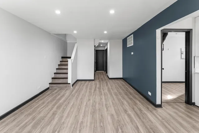 a view of entryway with wooden floor