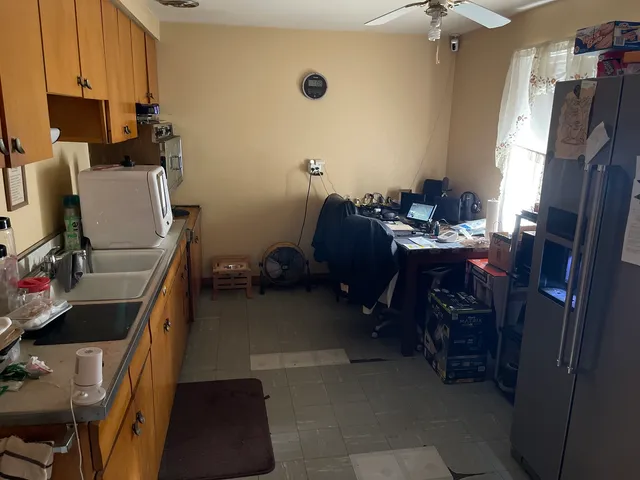 a room with furniture a flat screen tv and a window