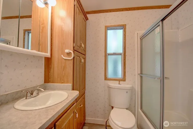 a view of front door with wooden cabinet