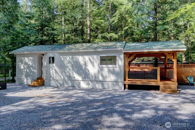 a backyard of a house with oven and tree
