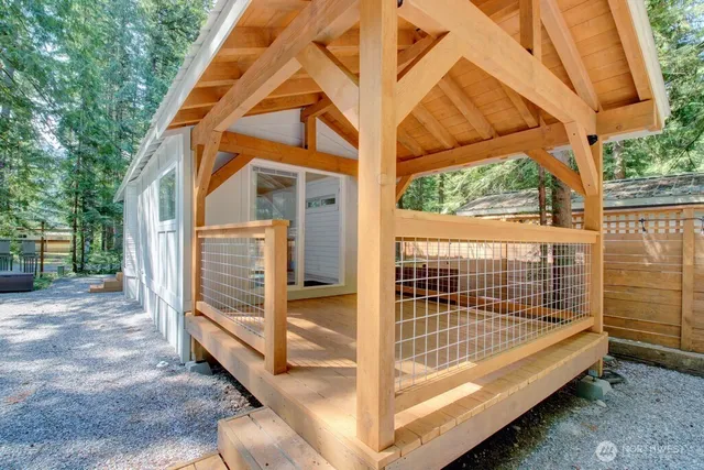 a kitchen with a refrigerator and a stove top oven