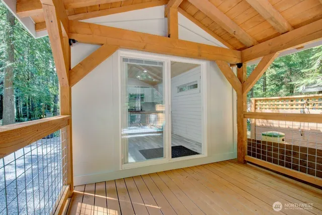 a kitchen with stainless steel appliances granite countertop a refrigerator a stove top oven a sink and dishwasher with wooden floor