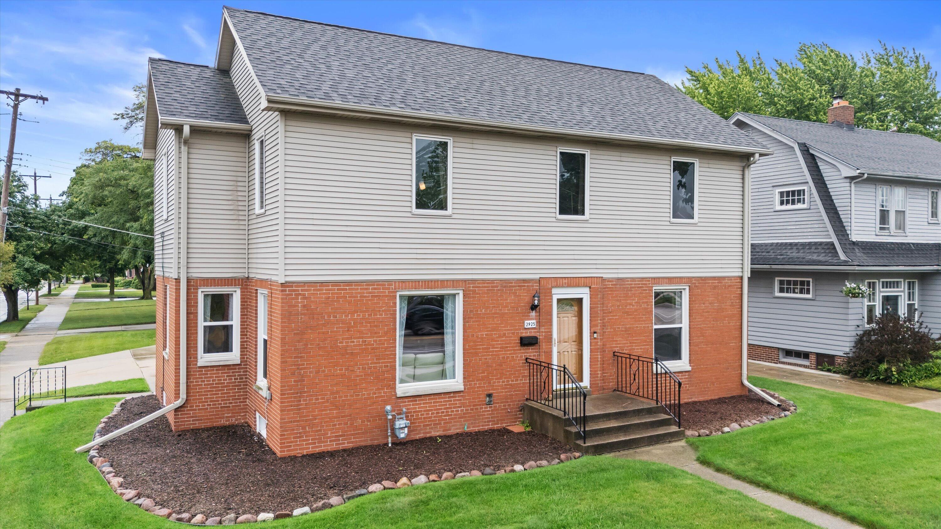 2925 North Main Street Racine, WI 53402 - Photo 3 of 23 Timeless brick construction paired with updated landscaping creates welcoming curb appeal that stands out in the neighborhood.
