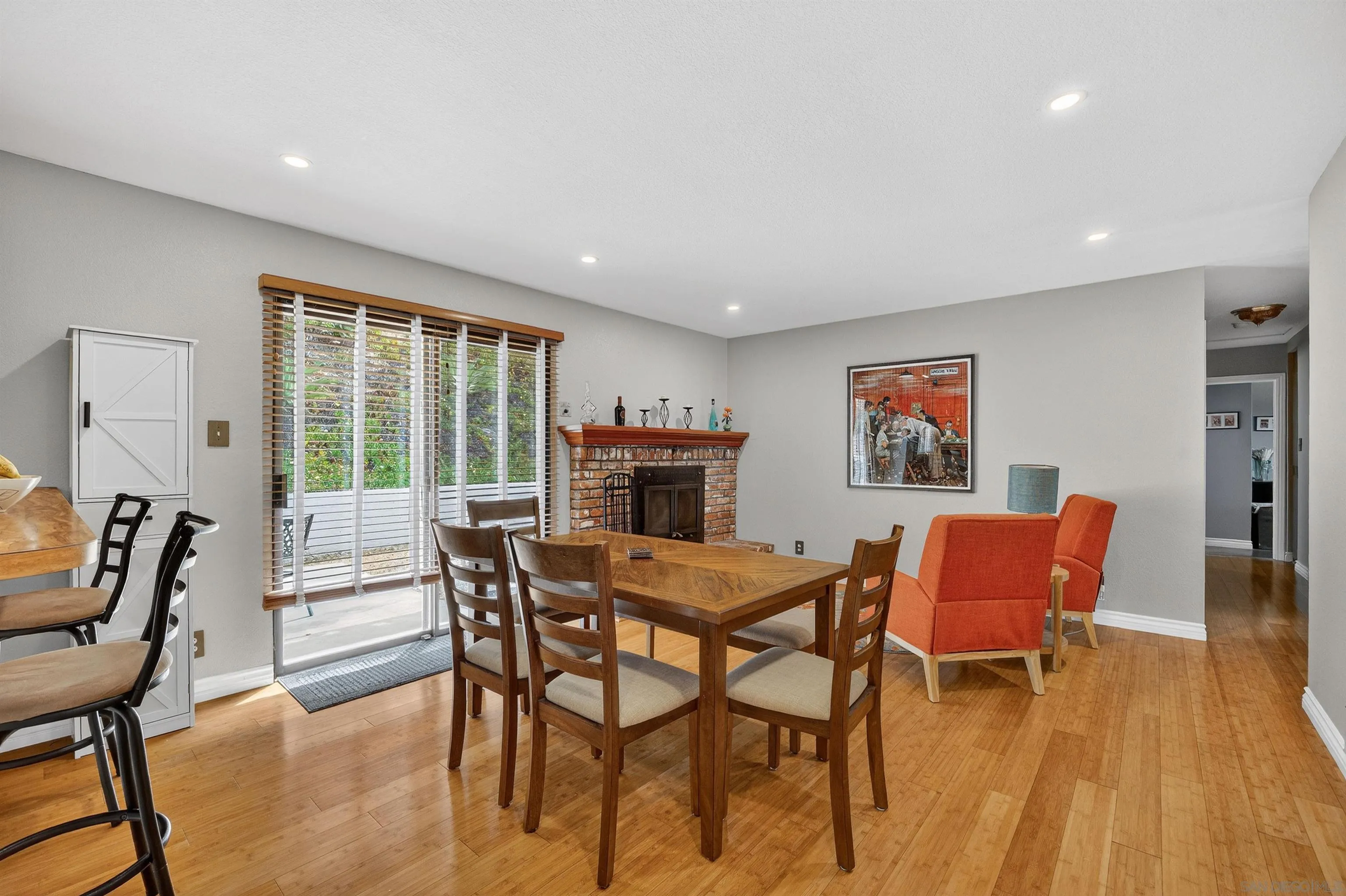 32721 Mountain View Road Bonsall, CA 92003 - Photo 10 of 33 a dining room with furniture and wooden floor