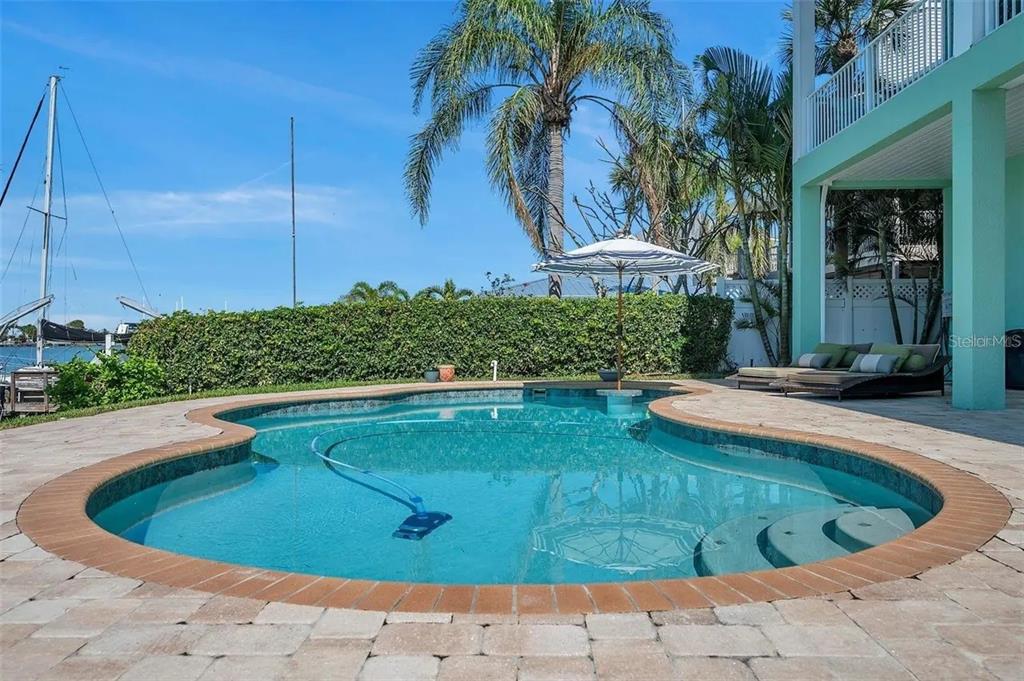 478 Harbor Drive South Indian Rocks Beach, FL 33785 - Photo 15 of 73 a view of a swimming pool with an outdoor space