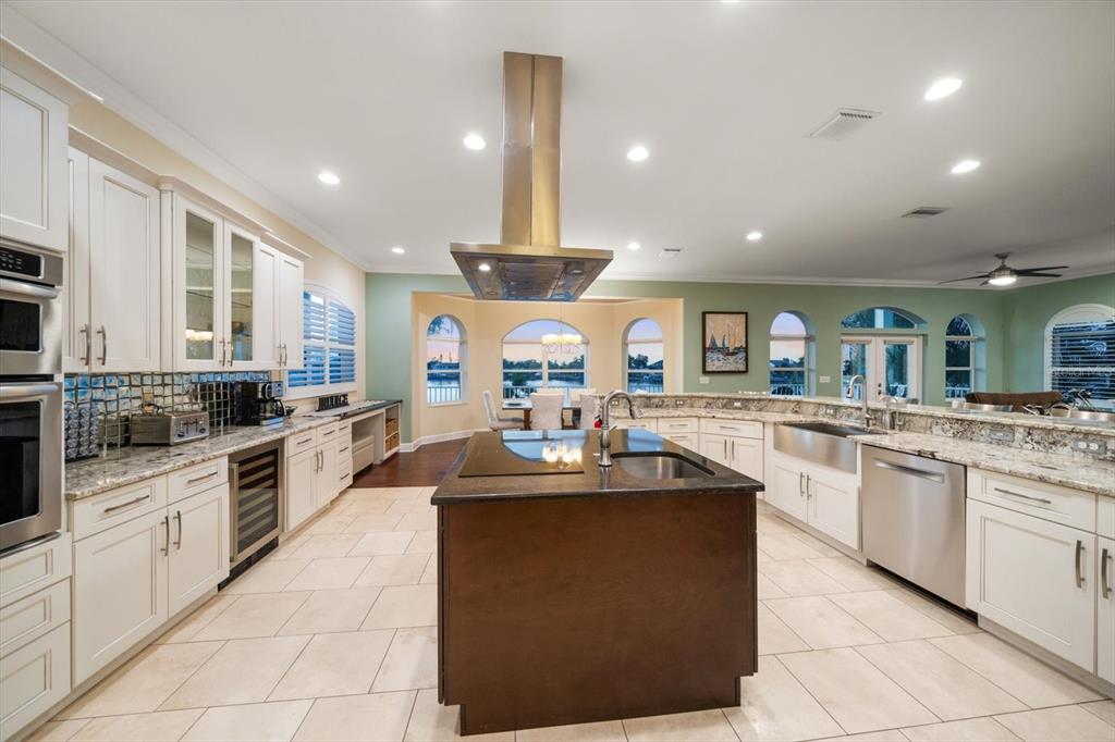 478 Harbor Drive South Indian Rocks Beach, FL 33785 - Photo 19 of 73 a kitchen with stainless steel appliances granite countertop a sink and stove
