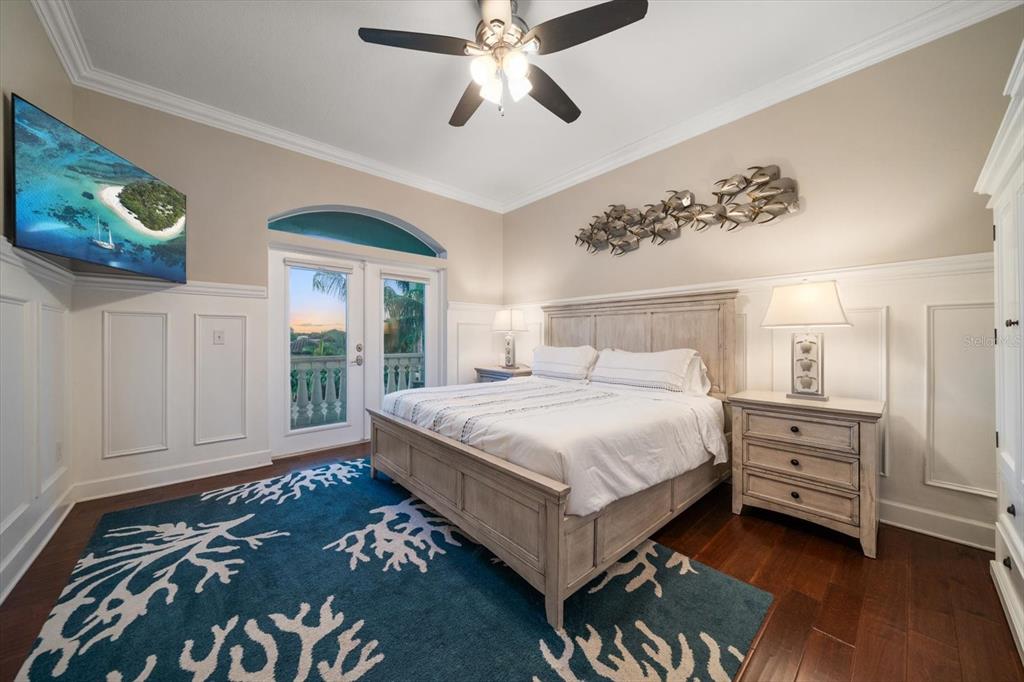 478 Harbor Drive South Indian Rocks Beach, FL 33785 - Photo 40 of 73 a bedroom with a bed and a chandelier