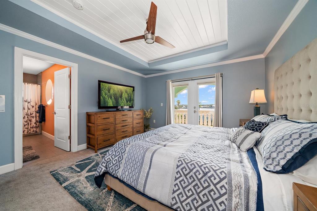 478 Harbor Drive South Indian Rocks Beach, FL 33785 - Photo 43 of 73 a bedroom with a bed and a flat screen television