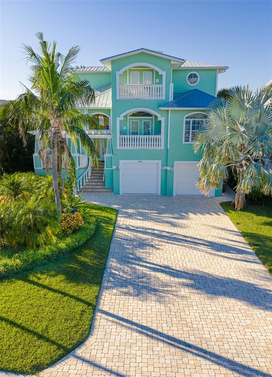 478 Harbor Drive South Indian Rocks Beach, FL 33785 - Photo 63 of 73 a front view of a house with a garden and yard