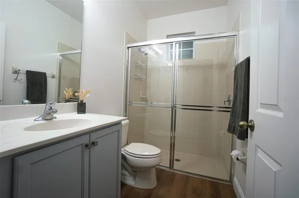 a bathroom with a sink toilet and shower