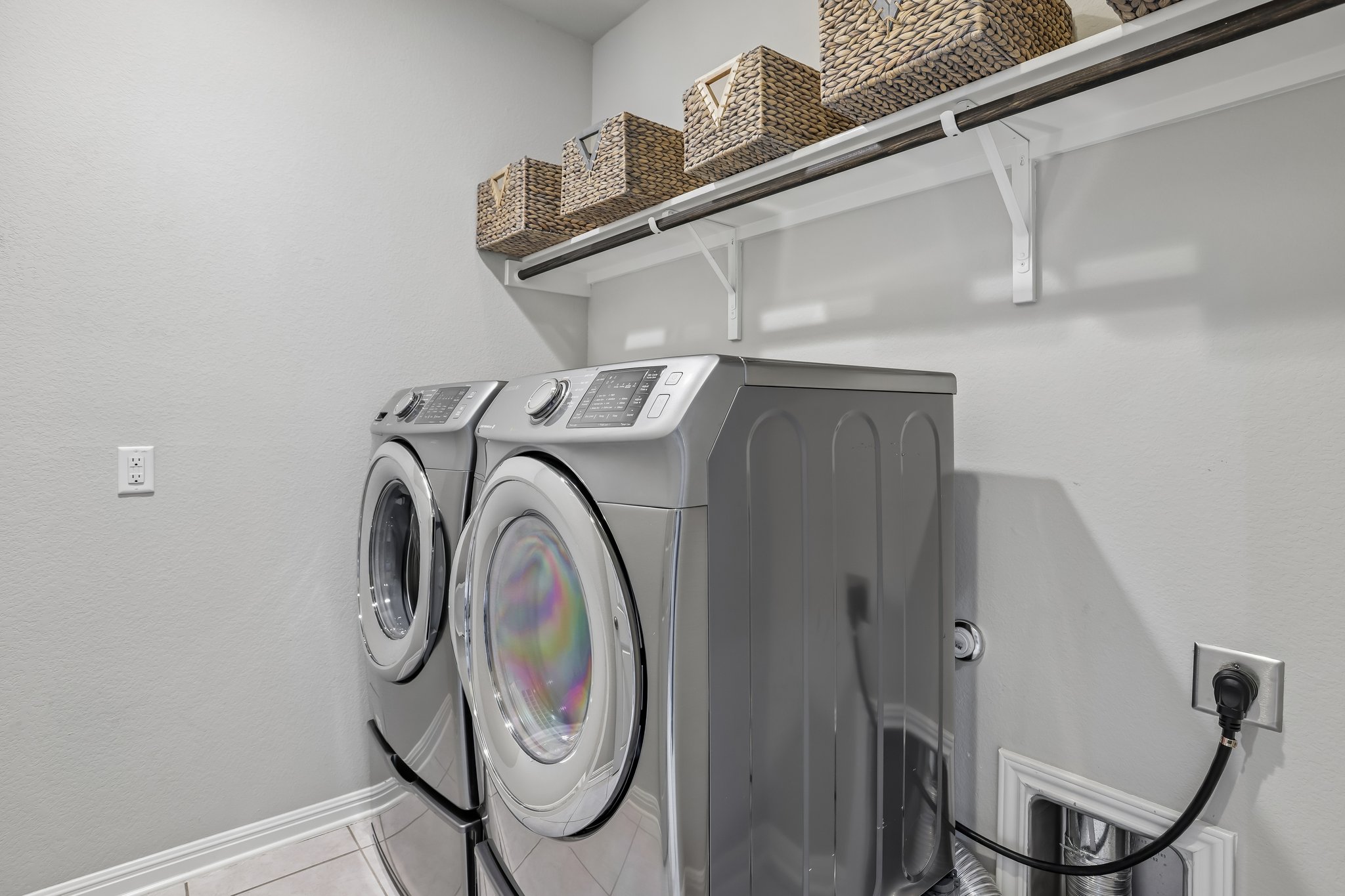 6801 Banff Cove Austin, TX 78754 - Photo 21 of 37 Laundry room complete with shelve and hanging bar