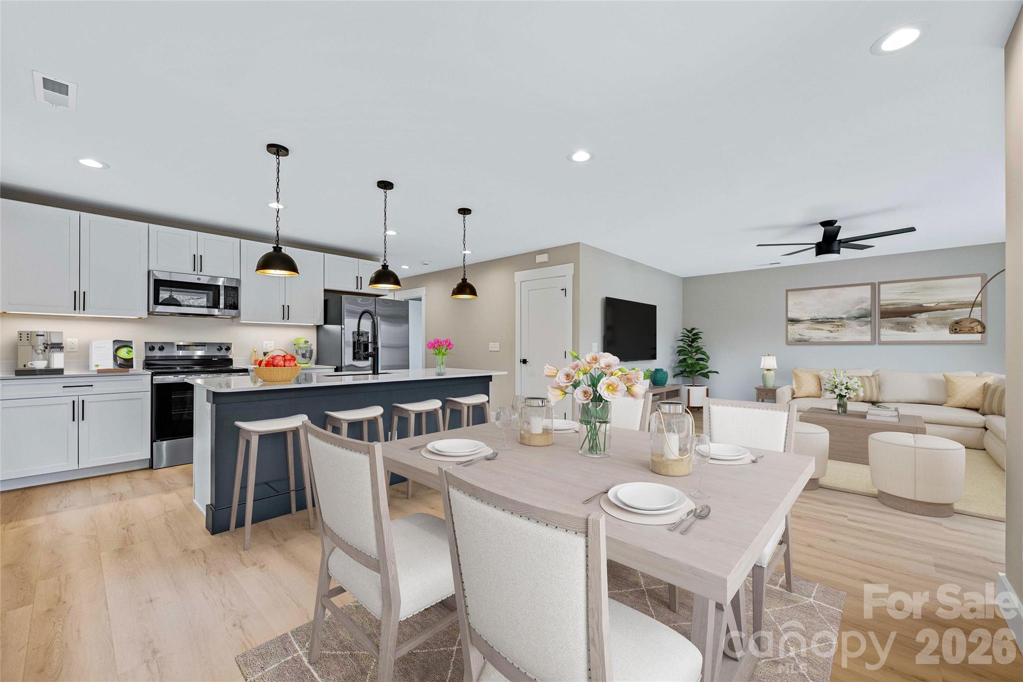 14 Knox Road Black Mountain, NC 28711 - Photo 20 of 44 a kitchen with stainless steel appliances kitchen island granite countertop a sink dishwasher stove and white cabinets with wooden floor
