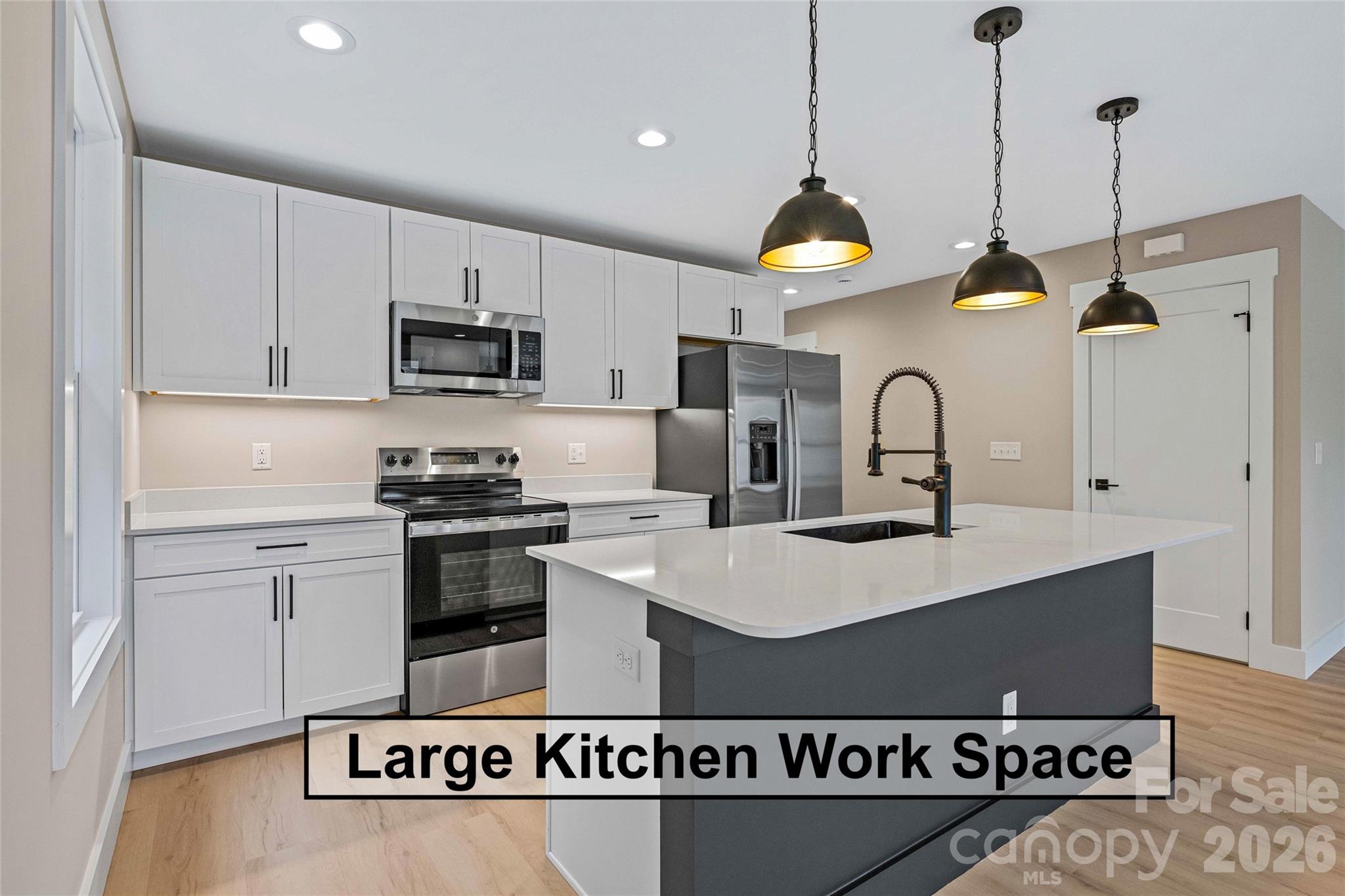 14 Knox Road Black Mountain, NC 28711 - Photo 24 of 44 a kitchen with stainless steel appliances granite countertop a sink a stove a refrigerator and cabinets