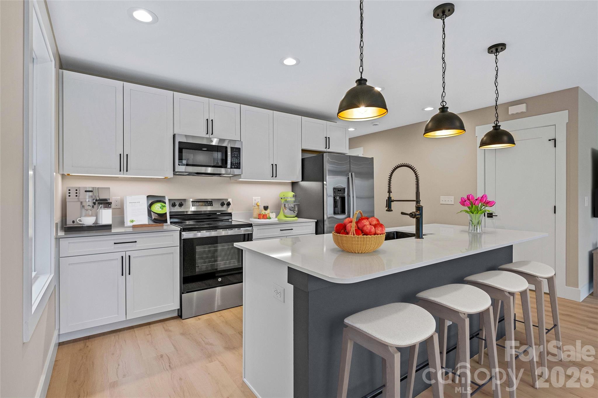 14 Knox Road Black Mountain, NC 28711 - Photo 25 of 44 a kitchen with stainless steel appliances granite countertop a sink a stove a dining table and chairs