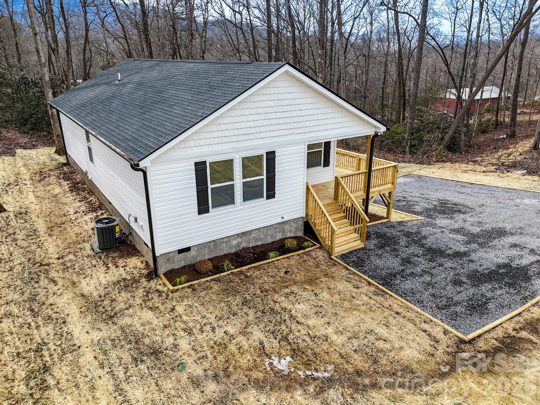 14 Knox Road Black Mountain, NC 28711 - Photo 3 of 44 a view of a wooden house with a yard