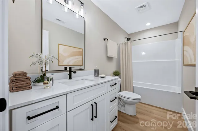 a view of room with window and ceiling fan