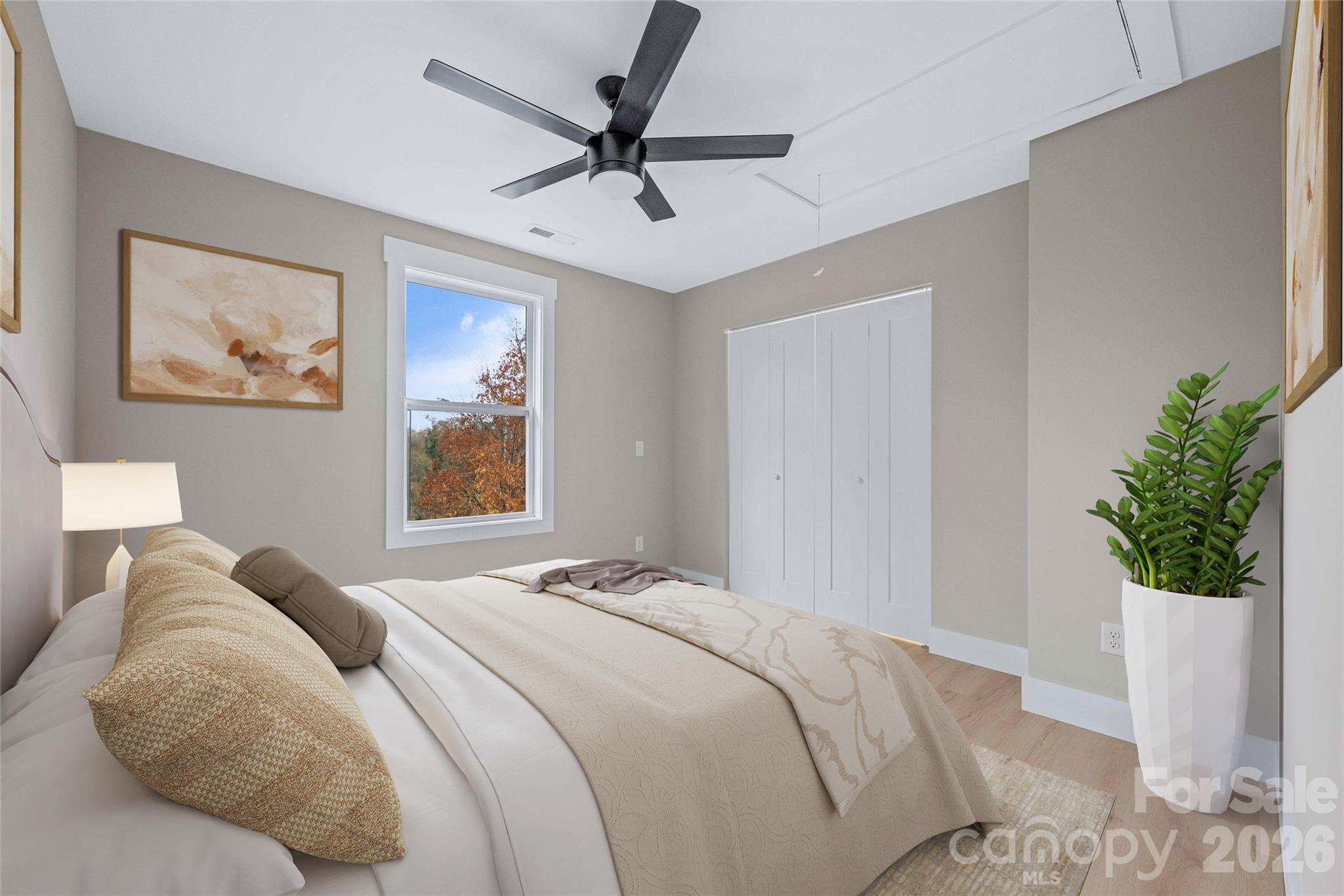 14 Knox Road Black Mountain, NC 28711 - Photo 36 of 44 a bedroom with a bed and a painting on the wall