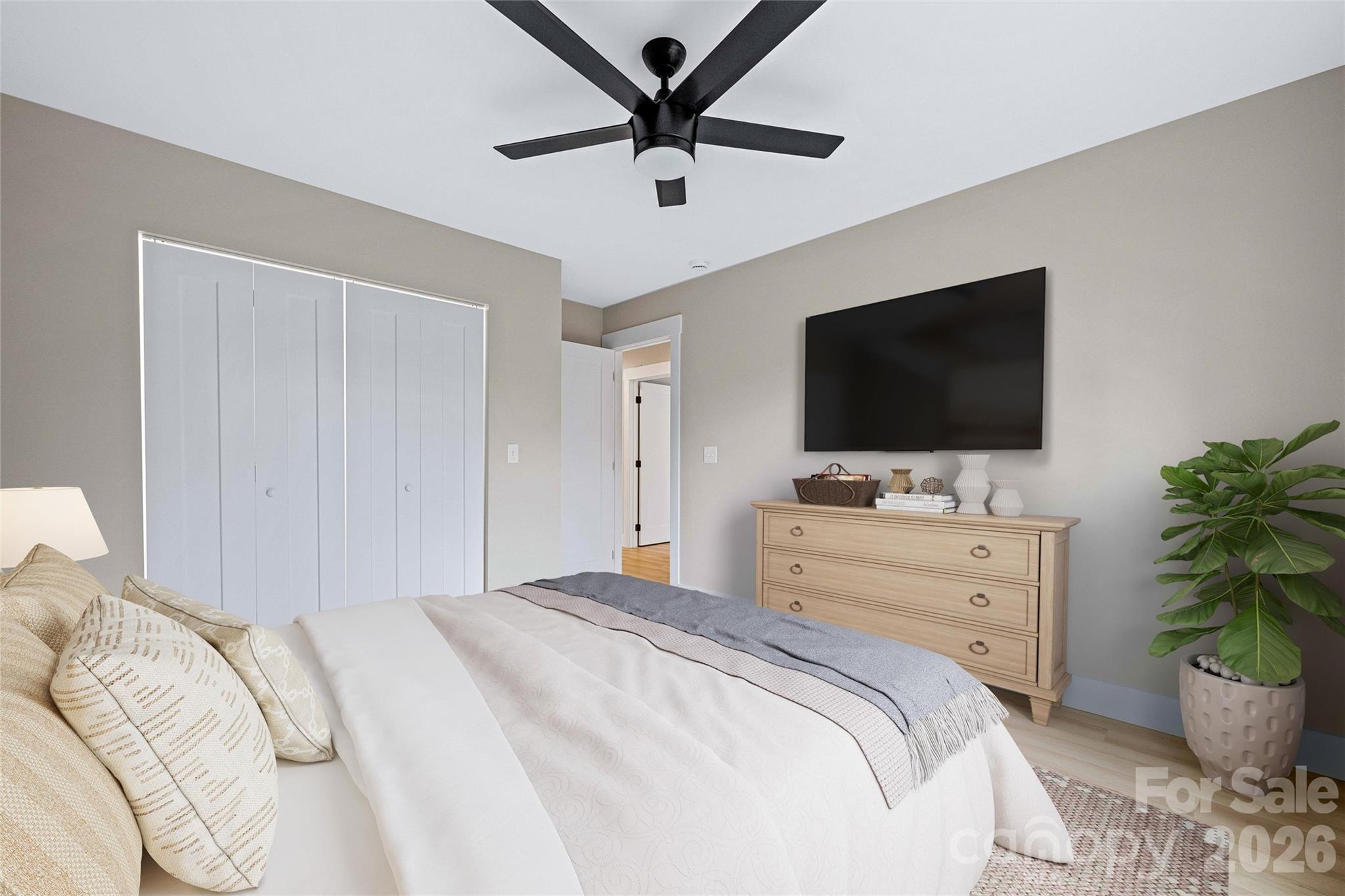 14 Knox Road Black Mountain, NC 28711 - Photo 43 of 44 a bedroom with a bed and a flat screen tv