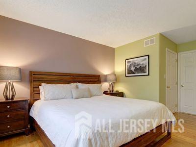 31 Edinburgh Court Edison, NJ 08820 - Photo 21 of 25 a bedroom with a bed and a night stand