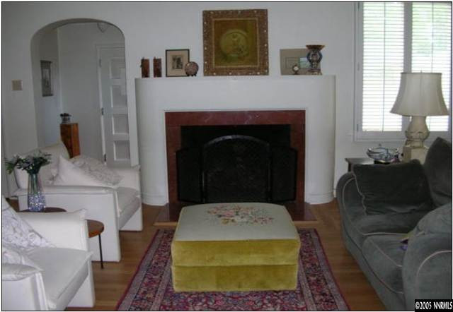 1017 Manor Drive Reno, NV 89509 - Photo 2 of 8 a living room with furniture and a fireplace