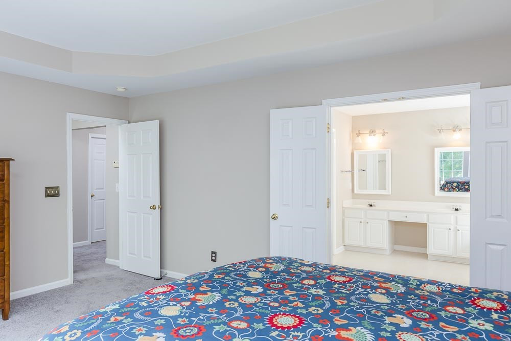 5419 Regatta Way Raleigh, NC 27613 - Photo 16 of 27 a bedroom with a bed and a dresser