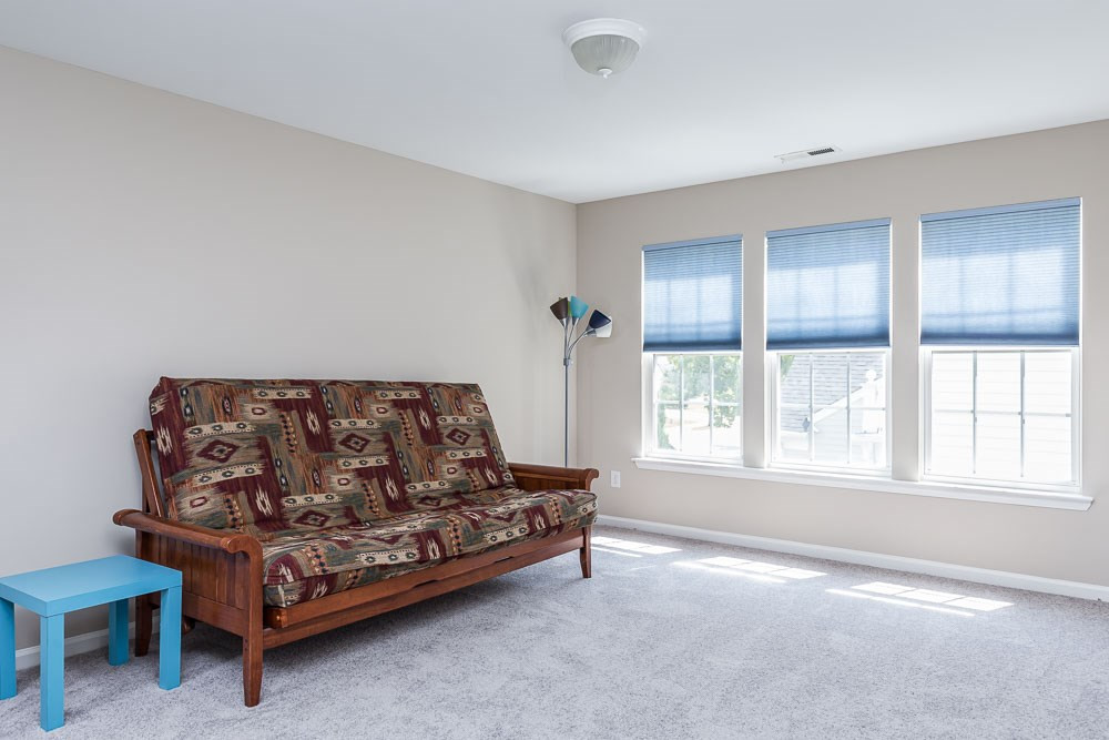 5419 Regatta Way Raleigh, NC 27613 - Photo 22 of 27 a living room with furniture and a window