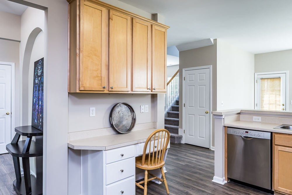 5419 Regatta Way Raleigh, NC 27613 - Photo 5 of 27 a very nice looking kitchen with wooden floor and cabinets
