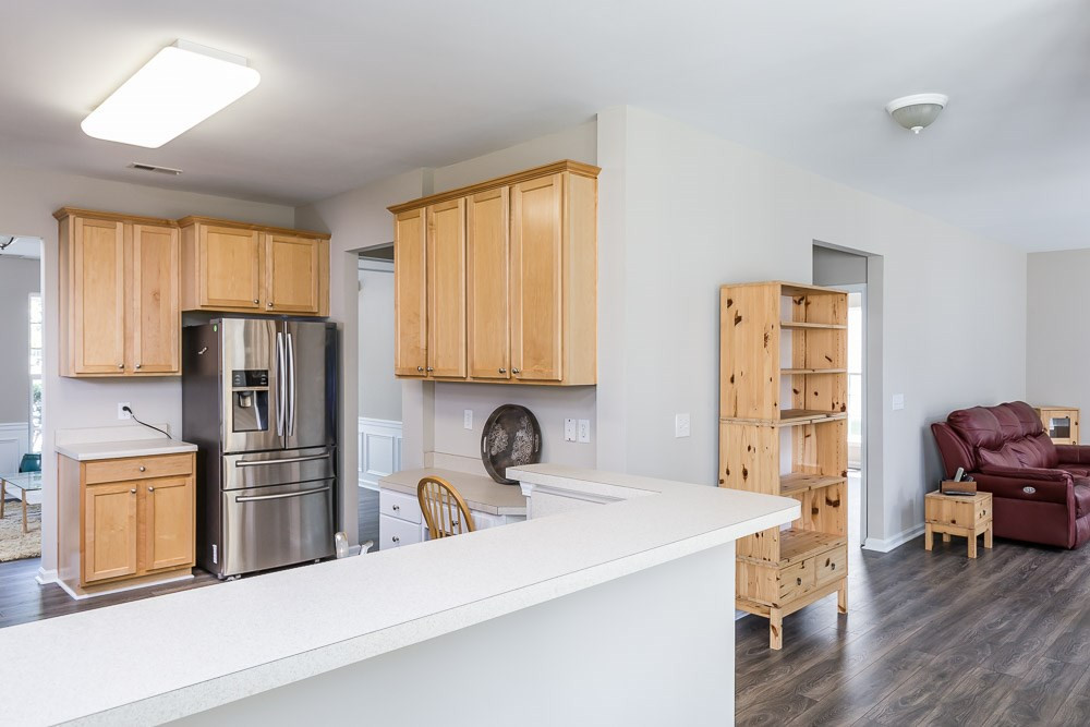 5419 Regatta Way Raleigh, NC 27613 - Photo 8 of 27 a kitchen with stainless steel appliances a refrigerator and a sink