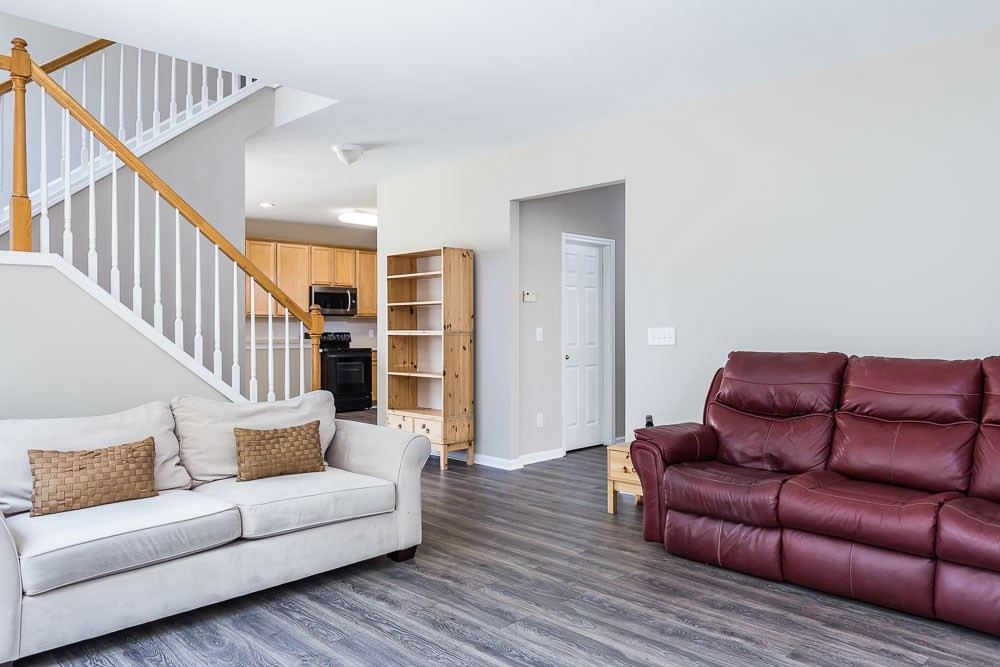 5419 Regatta Way Raleigh, NC 27613 - Photo 10 of 27 a living room with furniture and stairs