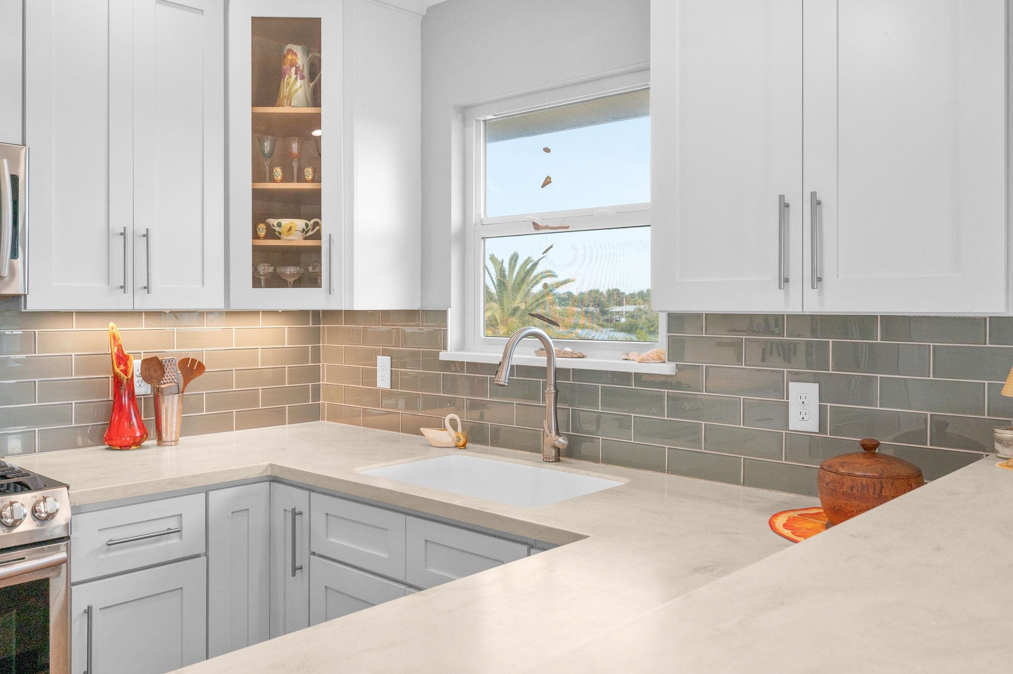 8950 Gene Johnson Road St. Augustine, FL 32080 - Photo 11 of 31 a kitchen with a sink and a stove