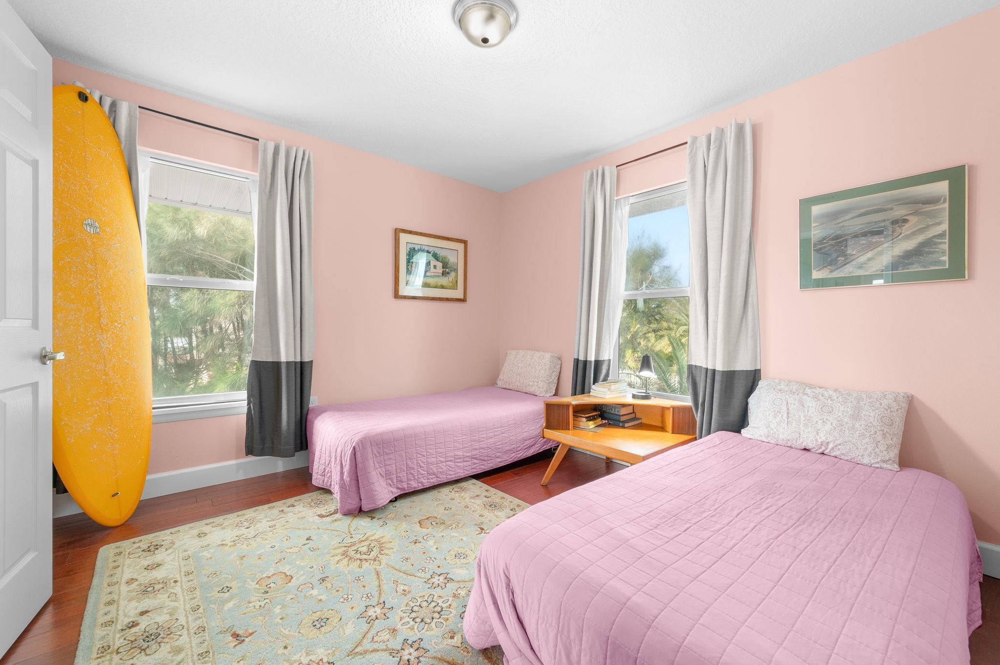 8950 Gene Johnson Road St. Augustine, FL 32080 - Photo 15 of 31 a bedroom with two beds and a large window