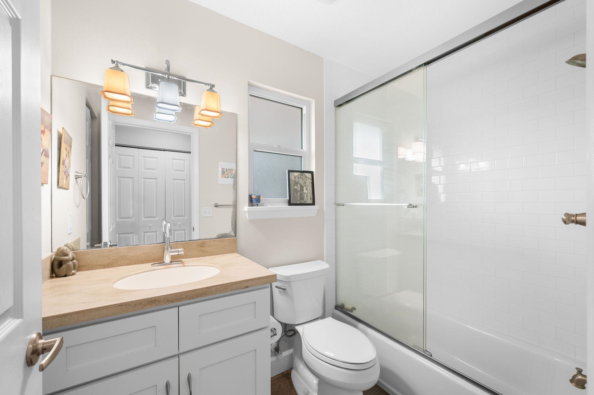 8950 Gene Johnson Road St. Augustine, FL 32080 - Photo 16 of 31 a bathroom with a sink a toilet and shower