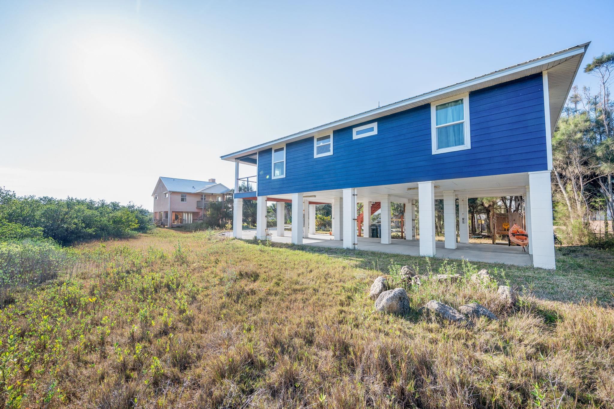 8950 Gene Johnson Road St. Augustine, FL 32080 - Photo 17 of 31 a front view of a house with a yard