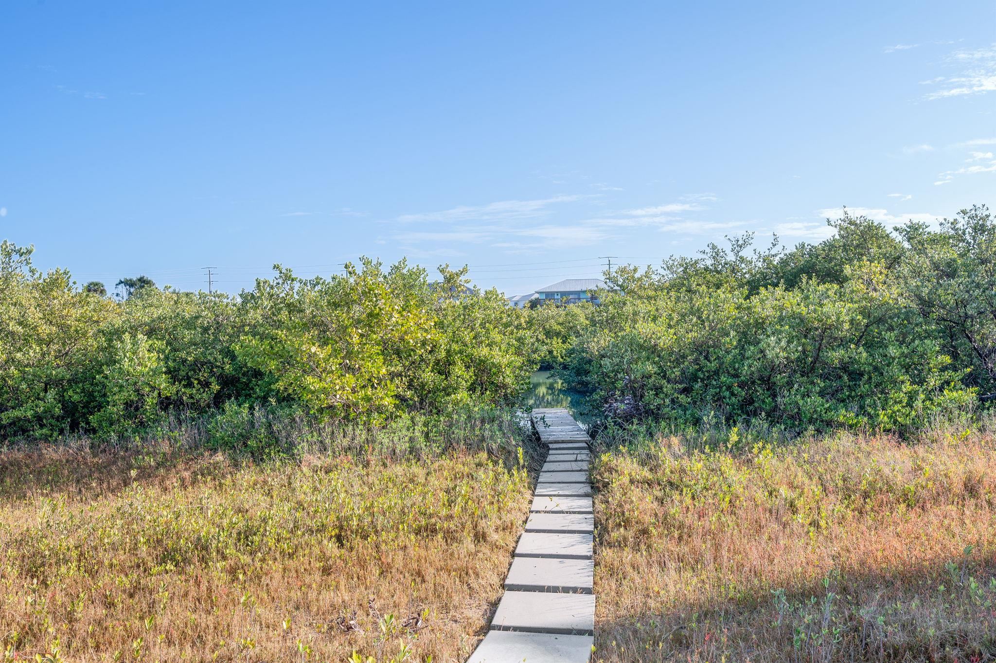 8950 Gene Johnson Road St. Augustine, FL 32080 - Photo 19 of 31 a view of a lake with a yard