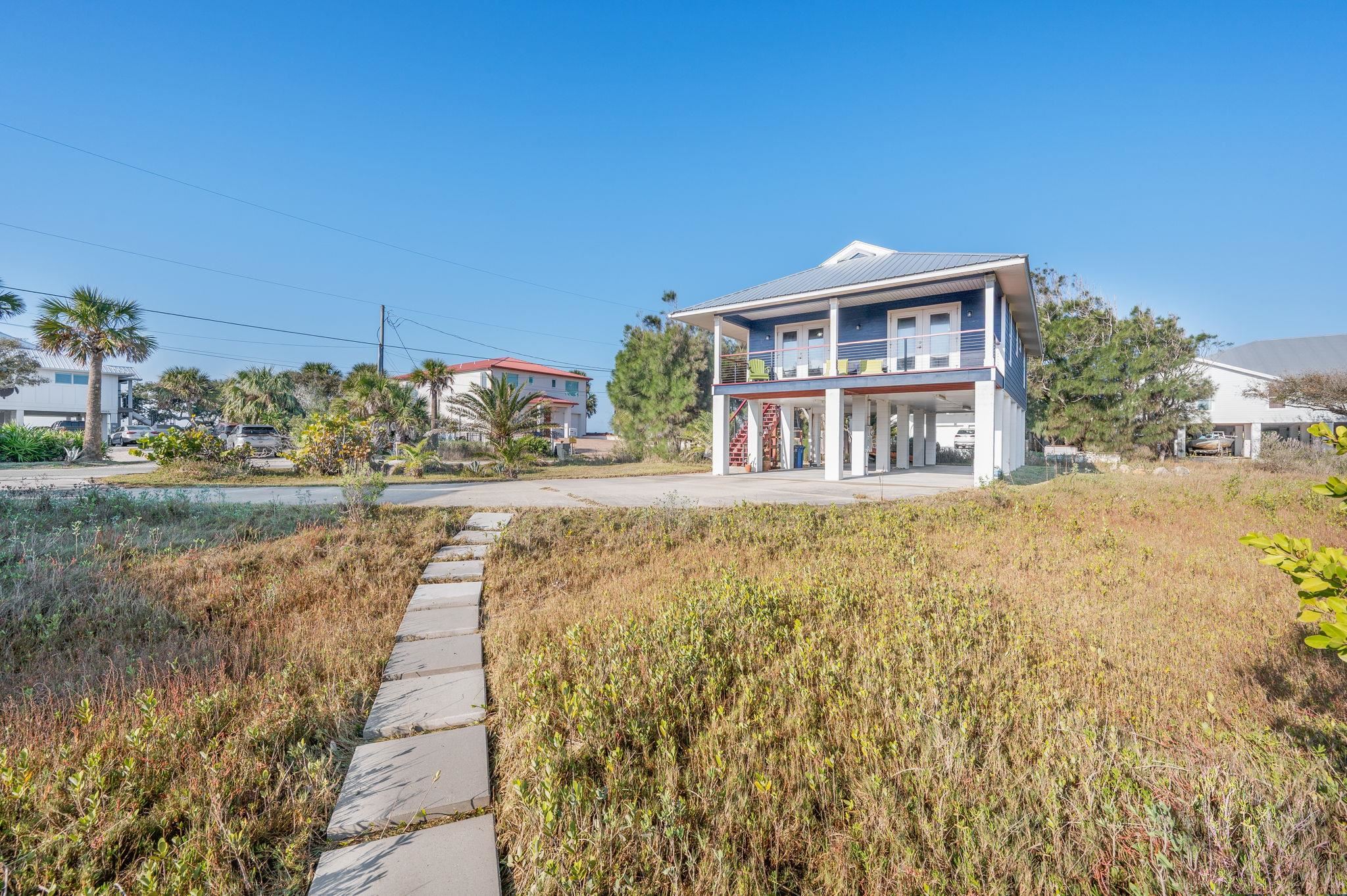 8950 Gene Johnson Road St. Augustine, FL 32080 - Photo 30 of 31 a front view of a house with a yard