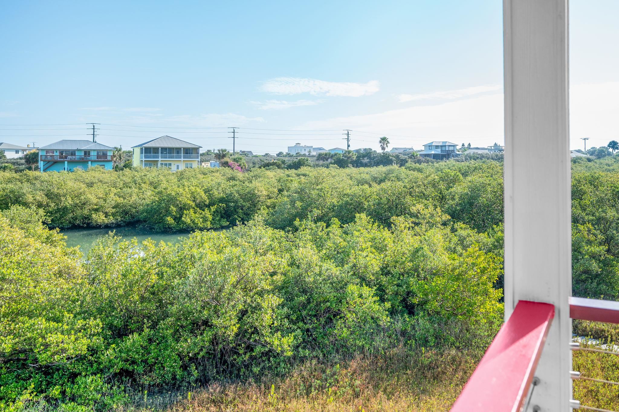 8950 Gene Johnson Road St. Augustine, FL 32080 - Photo 5 of 31 a view of a garden with a building in the background