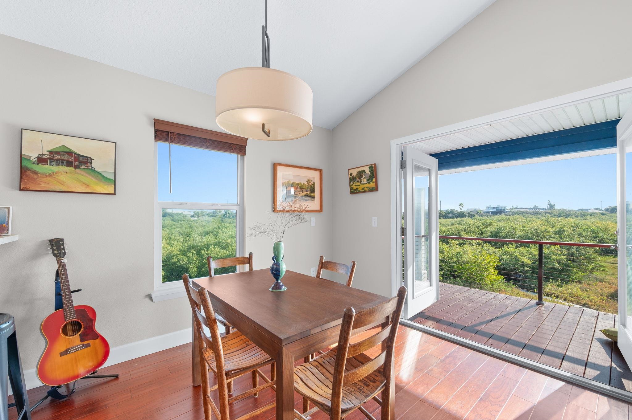 8950 Gene Johnson Road St. Augustine, FL 32080 - Photo 7 of 31 a view of a dining room with furniture window and outside view