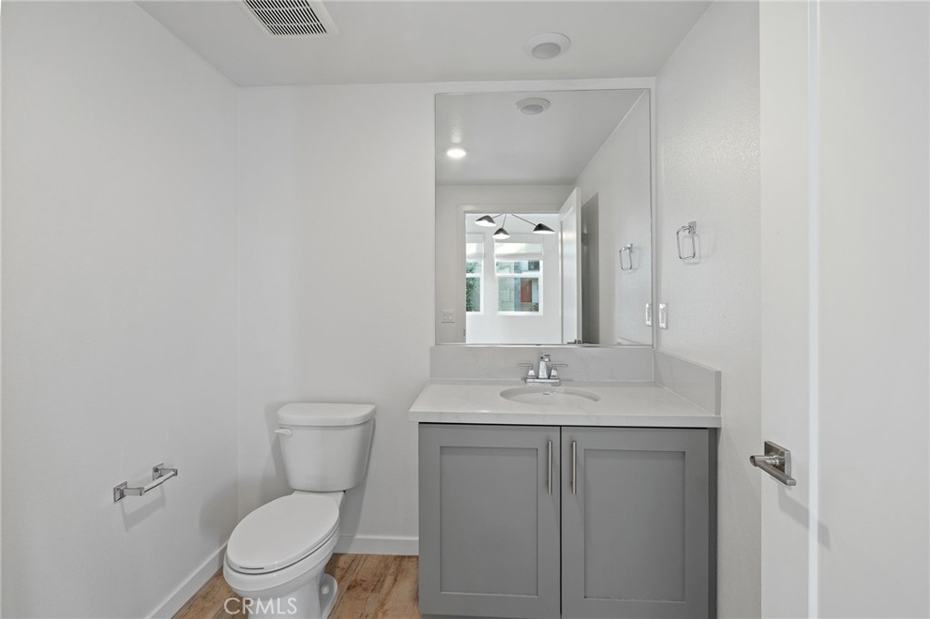 712 South Grable Circle Orange, CA 92868 - Photo 12 of 42 a bathroom with a toilet a sink and mirror
