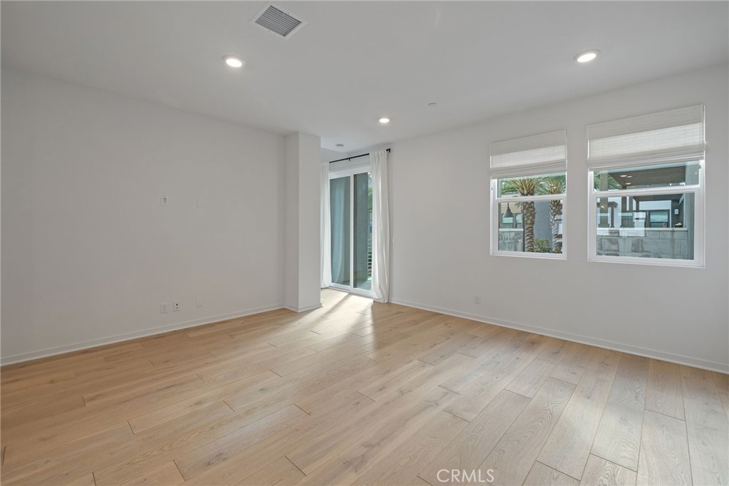 712 South Grable Circle Orange, CA 92868 - Photo 15 of 42 wooden floor in an empty room with a window