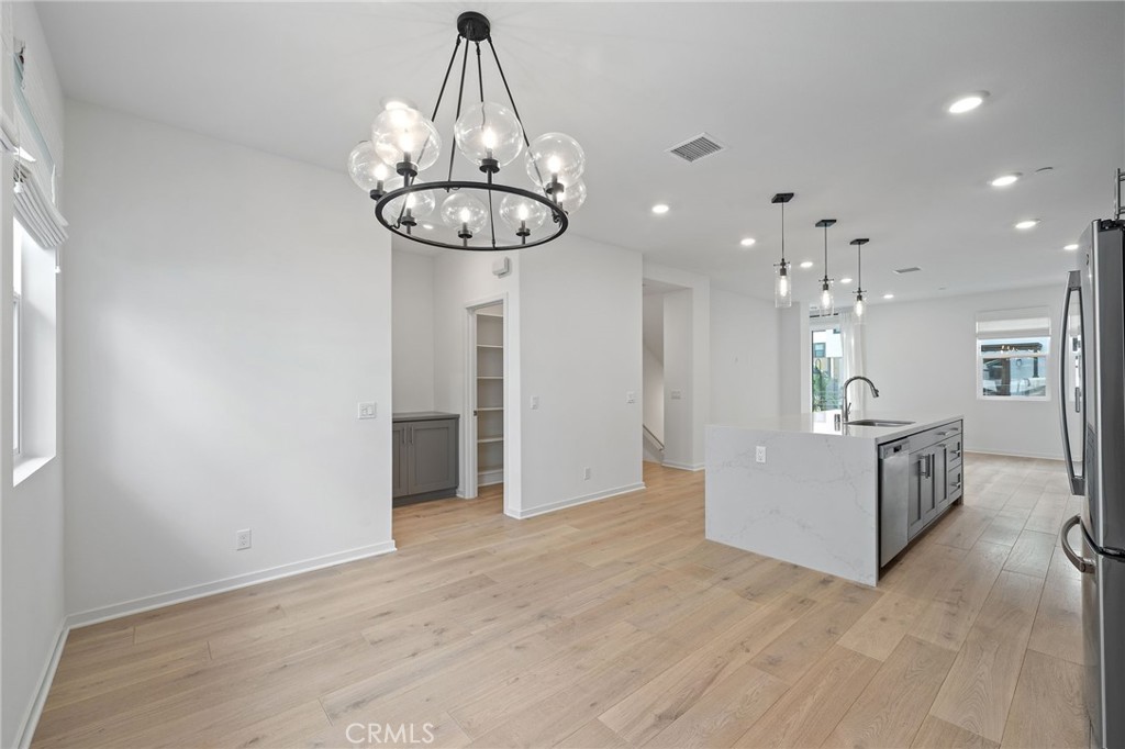 712 South Grable Circle Orange, CA 92868 - Photo 18 of 42 a view of a kitchen with a chandelier