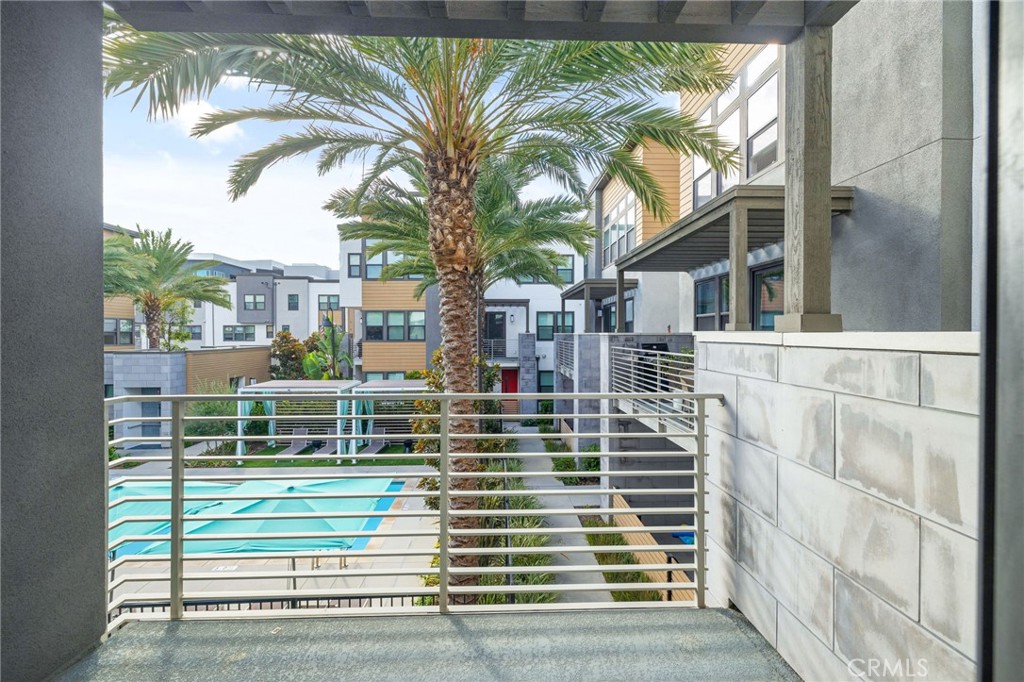 712 South Grable Circle Orange, CA 92868 - Photo 21 of 42 a view of a brick house with a large window and a palm tree