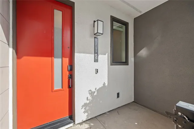 a front view of a house with a yard and a garage